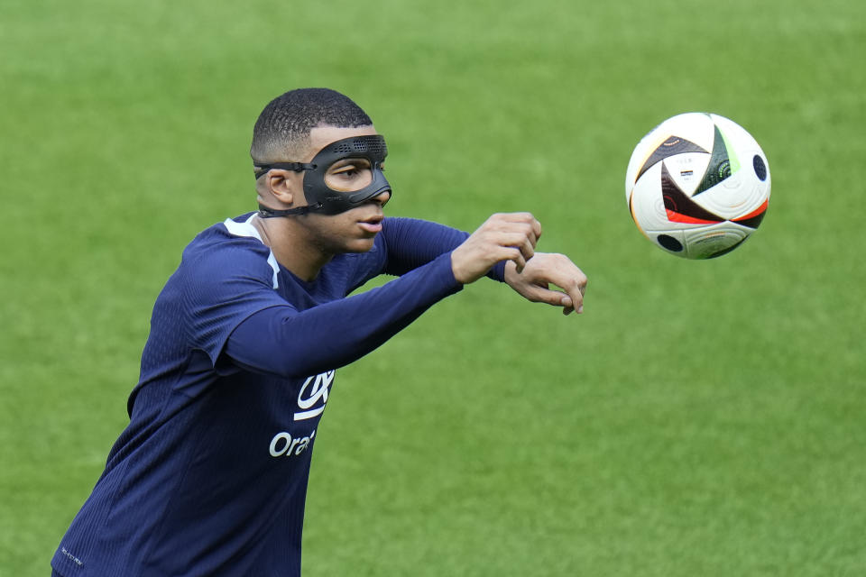 France's Kylian Mbappe eyes the ball during a training session in Paderborn, Germany, Thursday, June 27, 2024, ahead of their round of 16 soccer match against Belgium at the Euro 2024 soccer tournament. (AP Photo/Hassan Ammar)