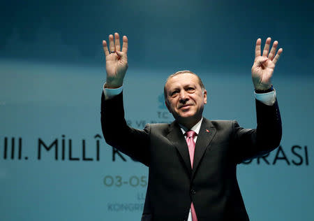 Turkish President Tayyip Erdogan greets the audience during a conference in Istanbul, Turkey, March 3, 2017. Yasin Bulbul/Presidential Palace/Handout via REUTERS