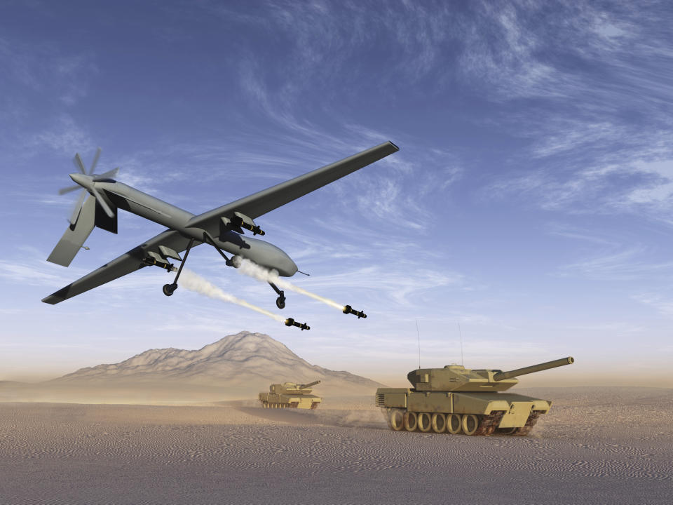 A drone firing rockets at a tank