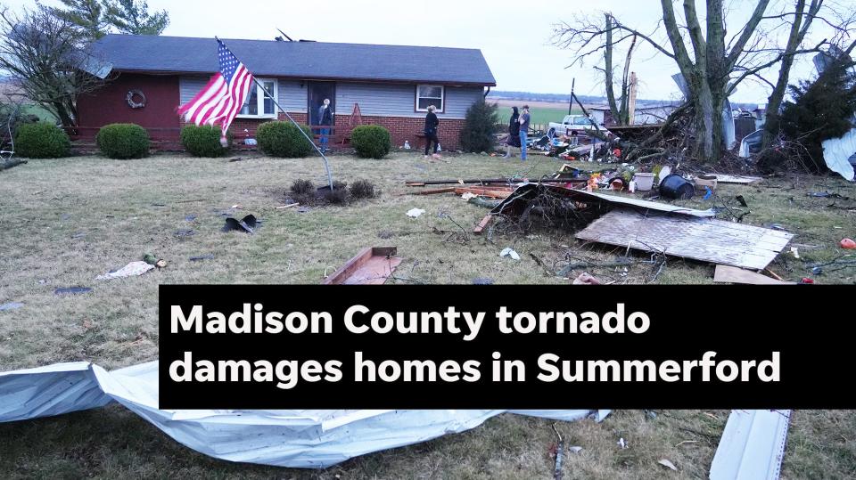 Feb 28, 2024; Columbus, Ohio, USA; Family members walk out of a storm-damaged home on Rt. 56 in Madison County Wednesday morning after strong storms blew through about 4 am. No one was injured at this home; three horses and a donkey in a barn on the property were not injured.