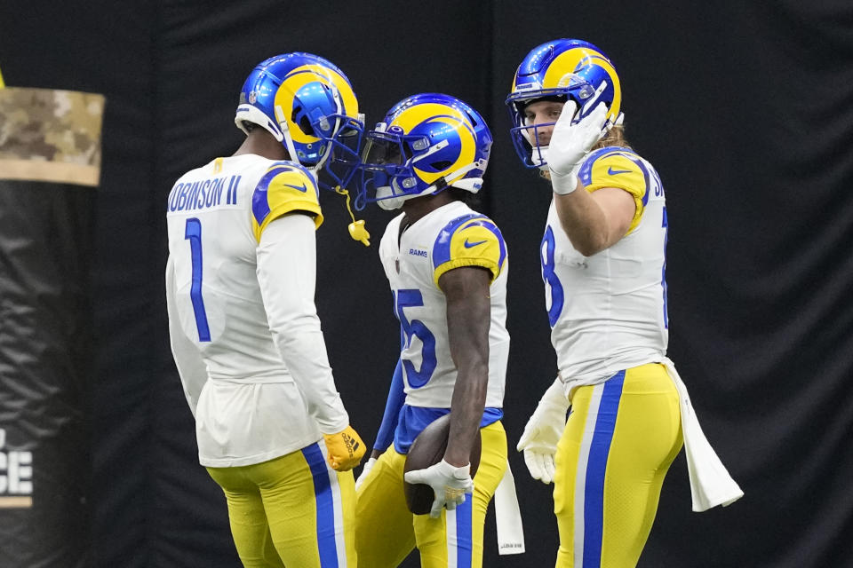 Los Angeles Rams wide receiver Tutu Atwell (15) celebrates with Allen Robinson II (1) after Atwell scored a touchdown against the New Orleans Saints in the first half of an NFL football game in New Orleans, Sunday, Nov. 20, 2022. (AP Photo/Gerald Herbert)