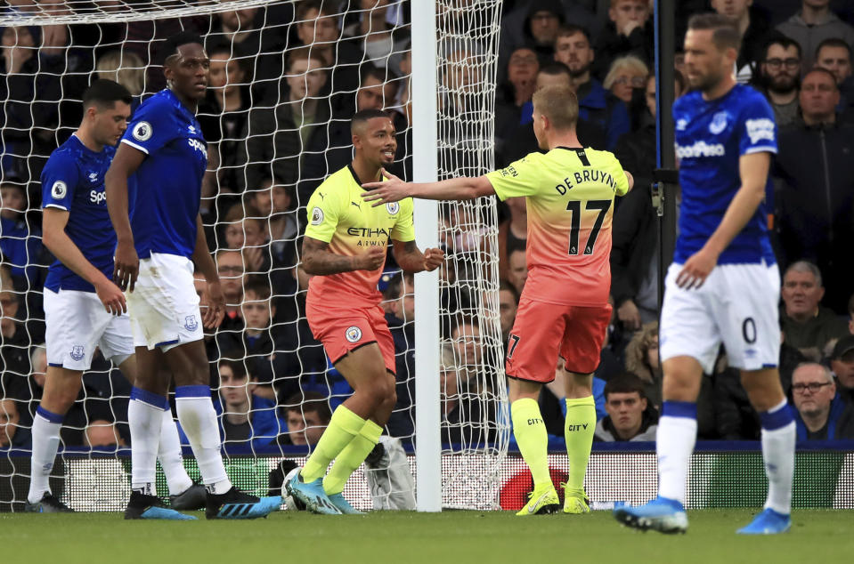 Manchester City's Gabriel Jesus, centre, celebrates scoring his side's first goal of the game against Everton during their English Premier League soccer match at Goodison Park in Liverpool, England, Saturday Sept. 28, 2019. (Peter Byrne/PA via AP)