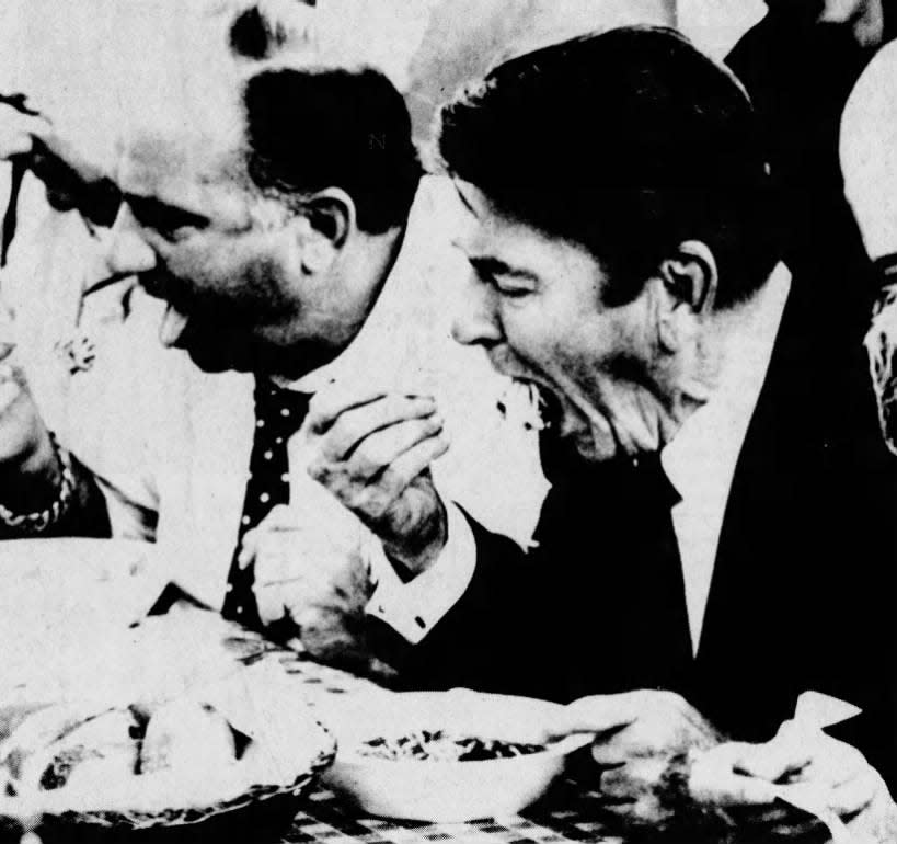 President Reagan digs into a plate of spaghetti at the San Gennaro Festival in Raritan Township on Friday, Sept. 17, 1982,
