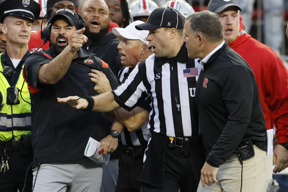 Ohio State head coach Ryan Day, left, argues with Rutgers head coach Greg Schiano during the second half of an NCAA college football game, Saturday, Oct. 1, 2022, in Columbus, Ohio. (AP Photo/Jay LaPrete)