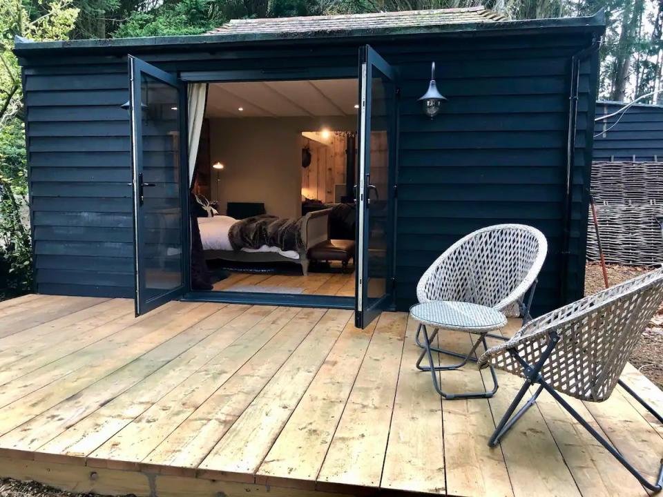 a small cabin with a deck