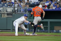Houston Astros' Chas McCormick (20) beats out a throw to Kansas City Royals first baseman Vinnie Pasquantino (9) as he reaches safely to first on a burn in the third inning during a baseball game Tuesday, April 9, 2024, in Kansas City, Mo. (AP Photo/Ed Zurga)