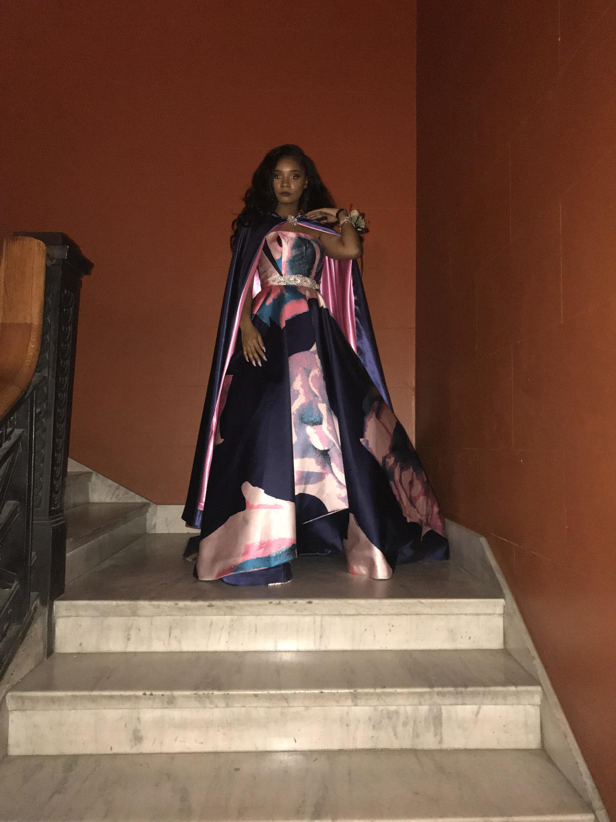 Kaylah Bell, 17, poses in her watercolor pink, purple and blue ballgown at prom. (Credit: Kaylah Bell)