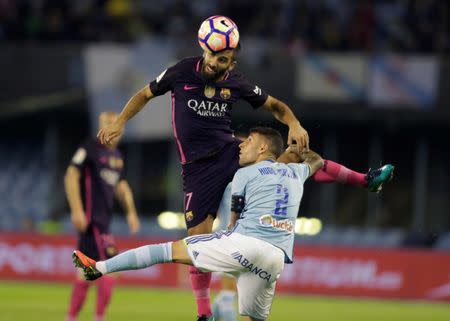 Football Soccer - Spanish Liga Vigo - Celta Vigo v FC Barcelona - Balaidos, Vigo, Spain - 02/10/16 Celta Vigo's Hugo Mallo (R) and FC Barcelona's Arda Turan in action. REUTERS/Miguel Vidal