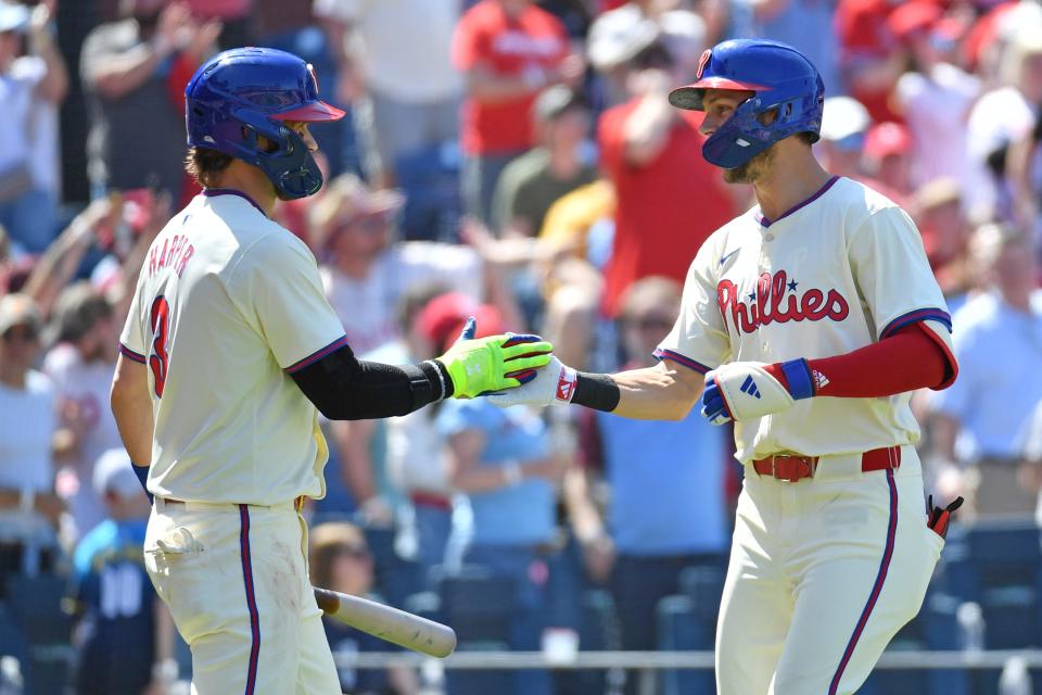 Philadelphia Phillies shortstop Trea Turner, right, celebrates his home run with first base Bryce Harper against the Pittsburgh Pirates Sunday, April 14, 2024, at Citizens Bank Park in Philadelphia. The Phillies lost 9-2.