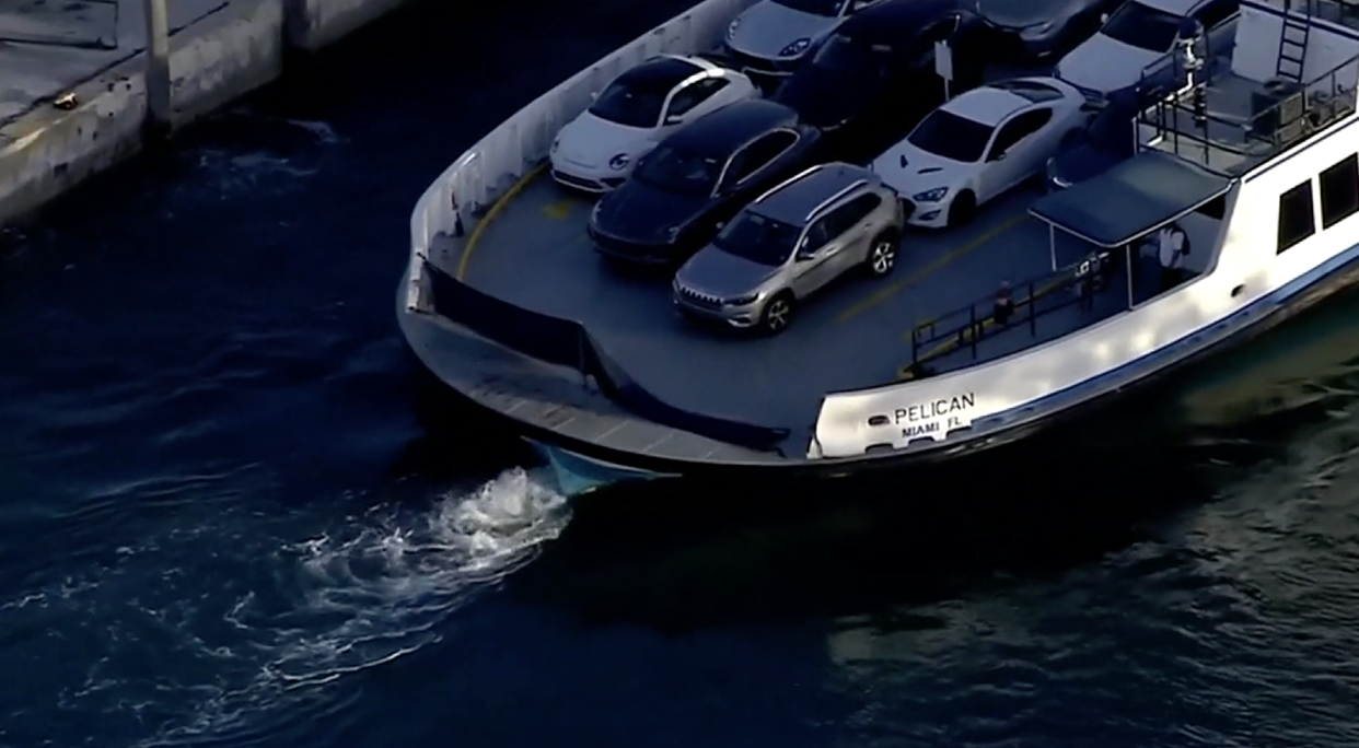 It is believed that the blue Mercedes Benz was parked next to the grey SUV on the Fisher Island Ferry, before going through the blue barrier and into the water: Local 10