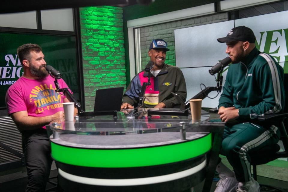 Eagles quarterback Jalen Hurts, pictured center, joins Jason Kelce (left) and Travis Kelce as the first guest on the sports podcast "New Heights with Jason & Travis Kelce," a JUKES original production from Wave Sports + Entertainment.