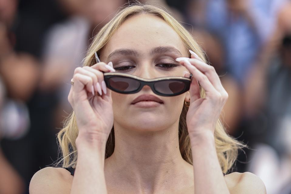 Lily-Rose Depp poses for photographers at the photo call for the television series "The Idol" at the 76th international television series festival, Cannes, southern France, Tuesday, May 23, 2023. (Photo by Vianney Le Caer/Invision/AP)