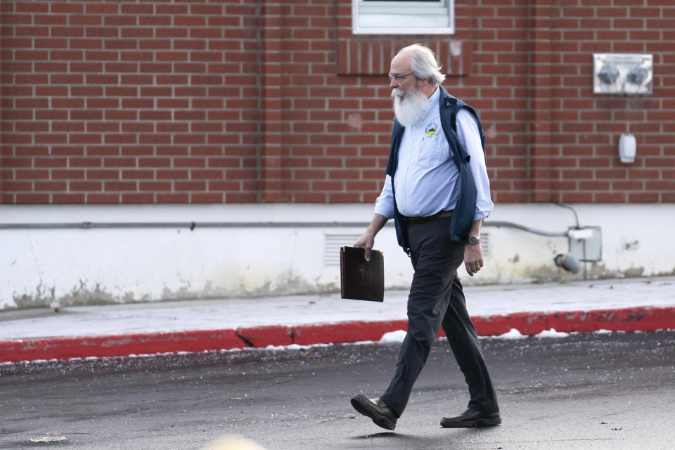 Latah County Prosecutor Bill Thompson leaves the Latah County Courthouse, Wednesday, Jan. 4, 2023, in Moscow, Idaho. Bryan Kohberger, who is accused of killing four University of Idaho students in November, 2022, has left a Pennsylvania jail in the custody of state police, officials said Wednesday, which means he could be headed to Idaho to face first-degree murder charges. (AP Photo/Ted S. Warren)