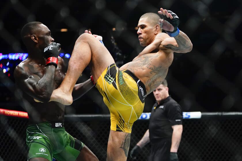 Brazil's Alex Pereira kicks Nigeria's Israel Adesanya during the first round of a middleweight bout at the UFC 281 mixed martial arts event, early Sunday, Nov. 13, 2022, in New York. Pereira stopped Adesanya in the fifth round. (AP Photo/Frank Franklin II)