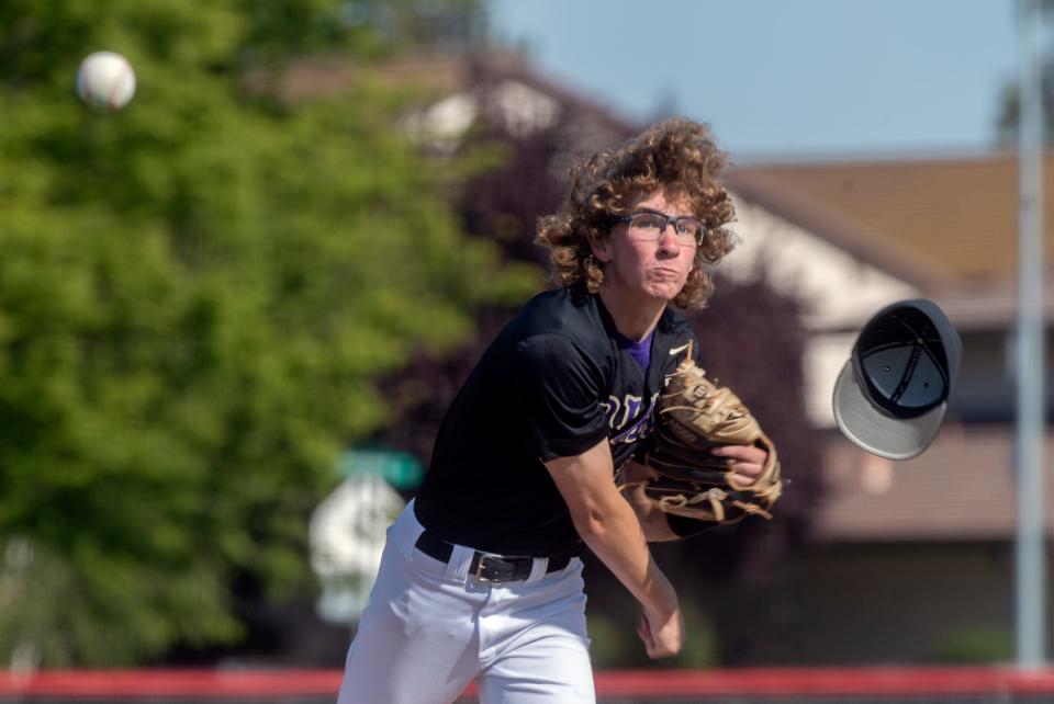 Tokay's Brock Sell's hat flies off as he delivers a pitch during a varsity baseball game at Lincoln in Stockton on Wednesday, Apr.19, 2023.