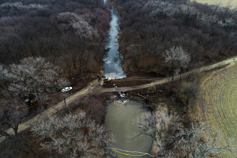 FILE - In this photo taken by a drone, cleanup continues in the area where the ruptured Keystone pipeline dumped oil into a creek in Washington County, Kan., on Dec. 9, 2022. A faulty weld at a bend in an oil pipeline contributed to a spill that dumped nearly 13,000 bathtubs' worth of crude oil into a northeastern Kansas creek, the pipeline's operator said Thursday, Feb. 9, 2023, estimating the cost of cleaning it up at $480 million. (DroneBase via AP, File)