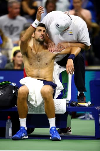 Novak Djokovic receives treatment for a left shoulder injury during his second-round victory Wednesday at the US Open