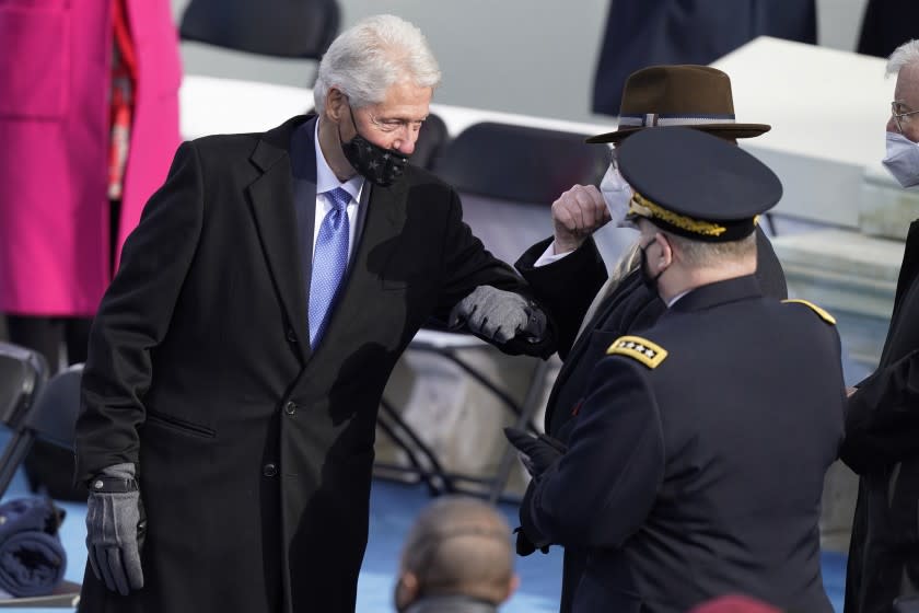 Washington , DC - January 20: Former U.S. President Bill Clinton arrives to the inauguration of U.S. President-elect Joe Biden on the West Front of the U.S. Capitol for the 59th presidential inauguration in Washington, D.C. on Wednesday, Jan. 20, 2021. (Kent Nishimura / Los Angeles Times)