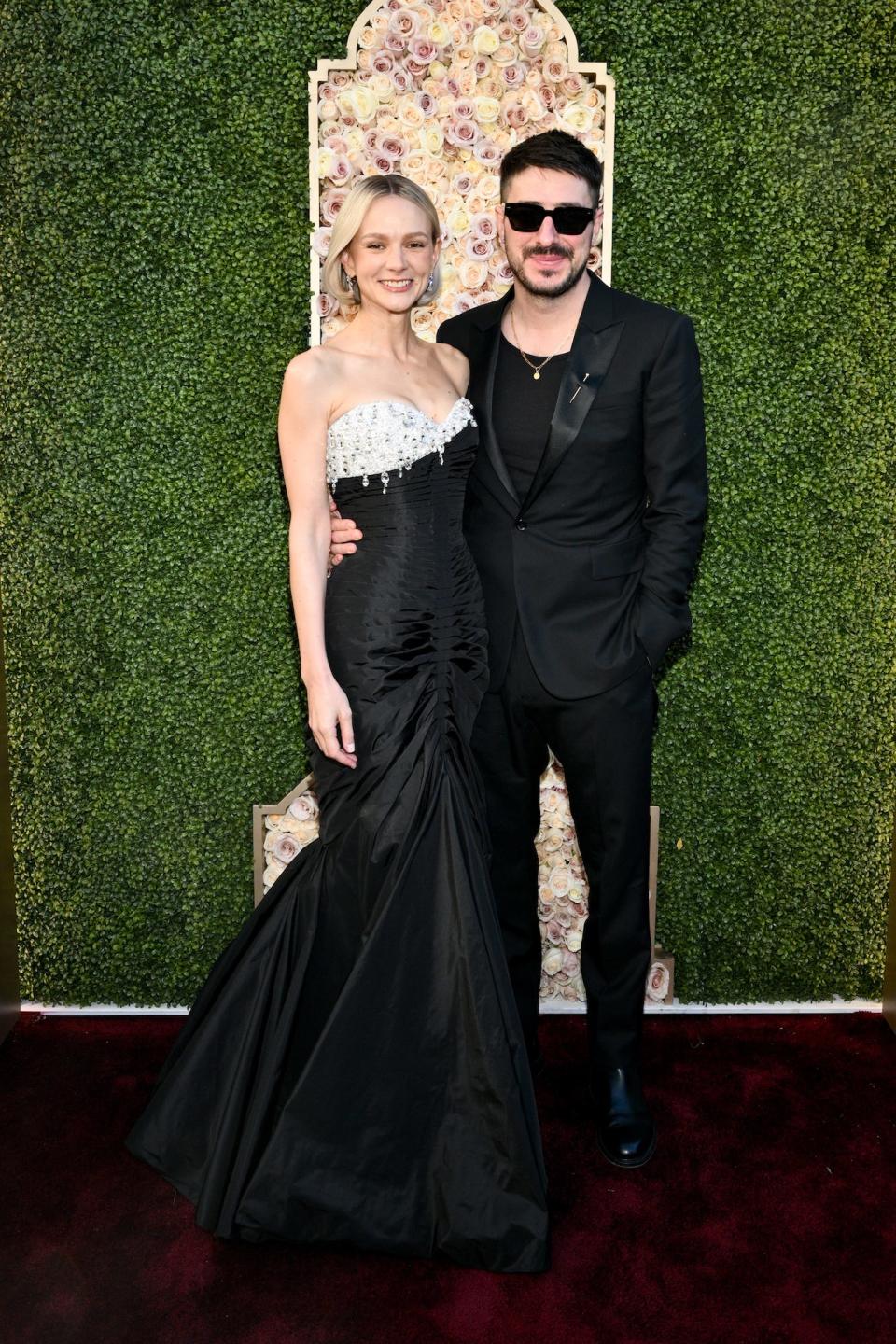 Carey Mulligan and Marcus Mumford attend the 2024 Golden Globes.