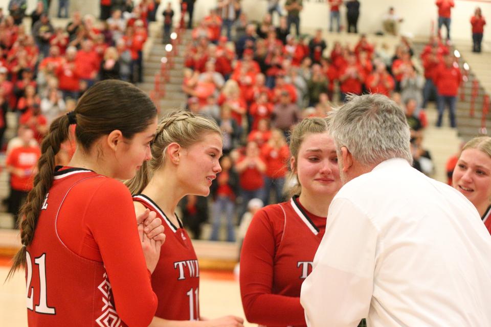 Benton Central coach David Baxter (right) delivers words of encouragement to senior Olivia Nickerson (right), junior Addie Bowsman (center) and senior Courtney Kyser (left) during the fourth quarter of the IHSAA Class 3A semifinals at Kent Adams Court on Friday, Feb. 2, 2024.