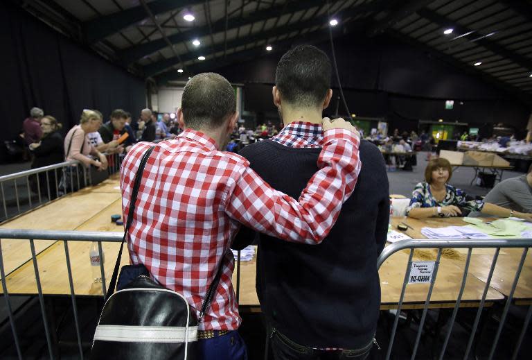 A couple watch the count at a count centre in Dublin following the vote on same-sex marriage in Ireland on May 23, 2015