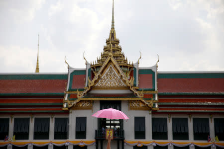 People wait outside the balcony of Suddhaisavarya Prasad Hall at the Grand Palace, where King Maha Vajiralongkorn will grant a public audience to receive the good wishes of the people in Bangkok, Thailand May 6, 2019. REUTERS/Navesh Chitrakar