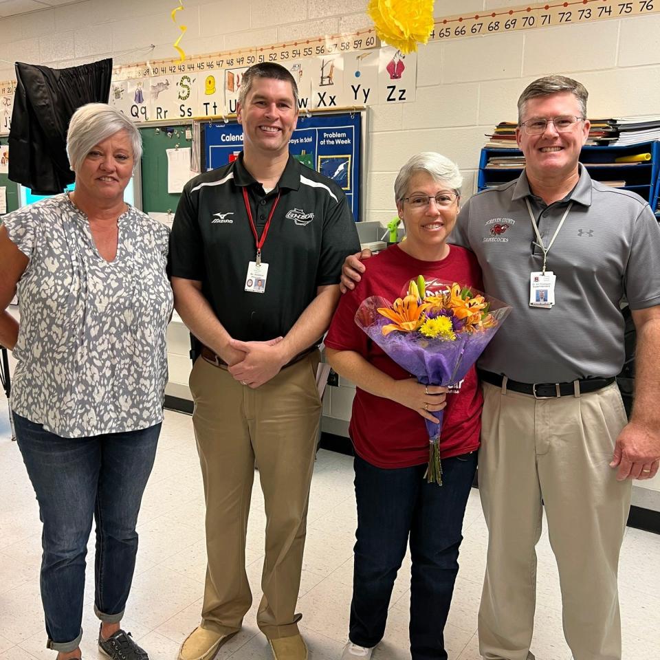 Screven County Elementary School teacher Lynn Martinez, second from right, was honored as the school's 2022-2023 Teacher of the Year by Principal Ryan Reddick, second from left, Special Education Director Linda Sanders, left, and Superintendent Jim Thompson.