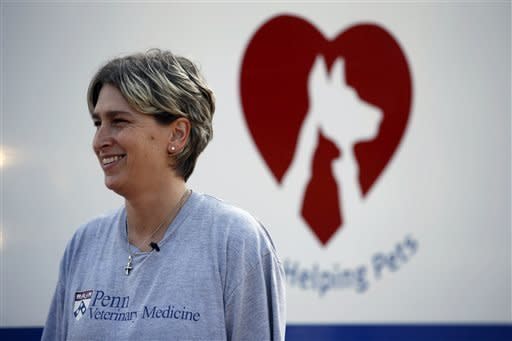 Certified veterinary technician Kym Marryott smiles while talking with a reporter outside the University of Pennsylvania veterinary school's animal bloodmobile in Harleysville, Pa. 