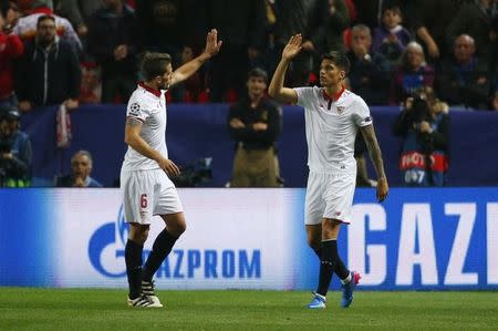 Soccer Football - Sevilla v Leicester City - UEFA Champions League Round of 16 First Leg - Ramon Sanchez Pizjuan Stadium, Seville, Spain - 22/2/17 Sevilla's Joaquin Correa celebrates scoring their second goal with Daniel Carrico Reuters / Paul Hanna