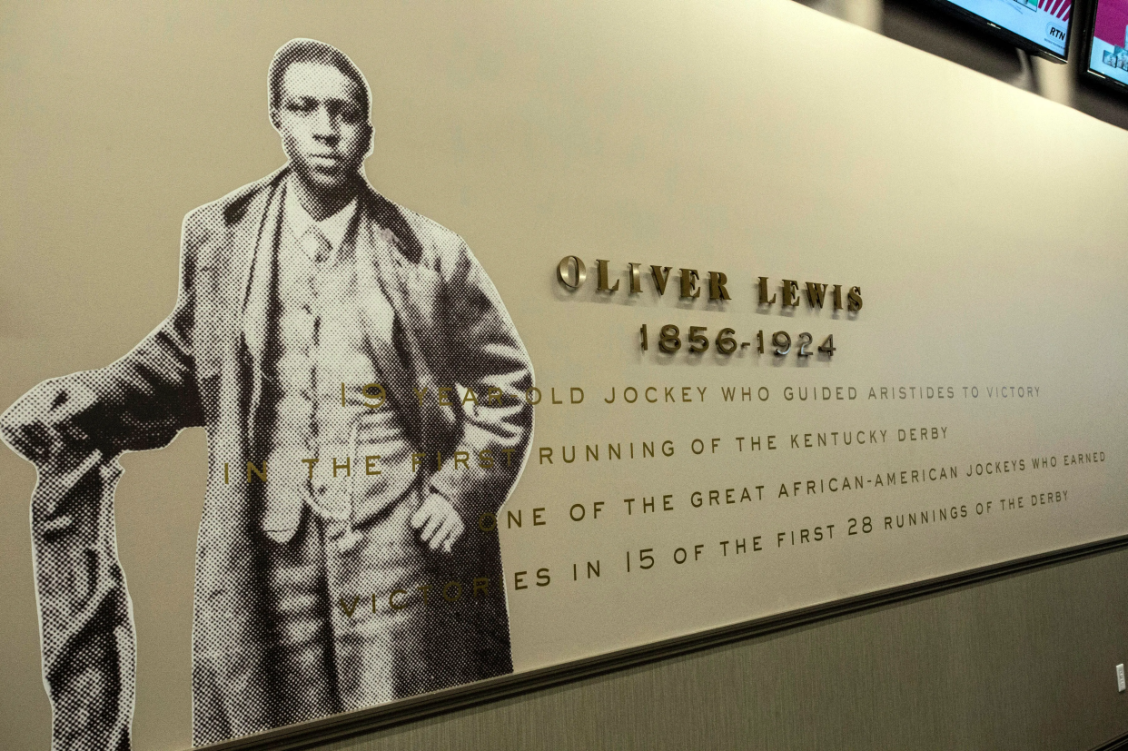 Oliver Lewis is honored in the Aristides Lounge as the first jockey to win the Kentucky Derby.