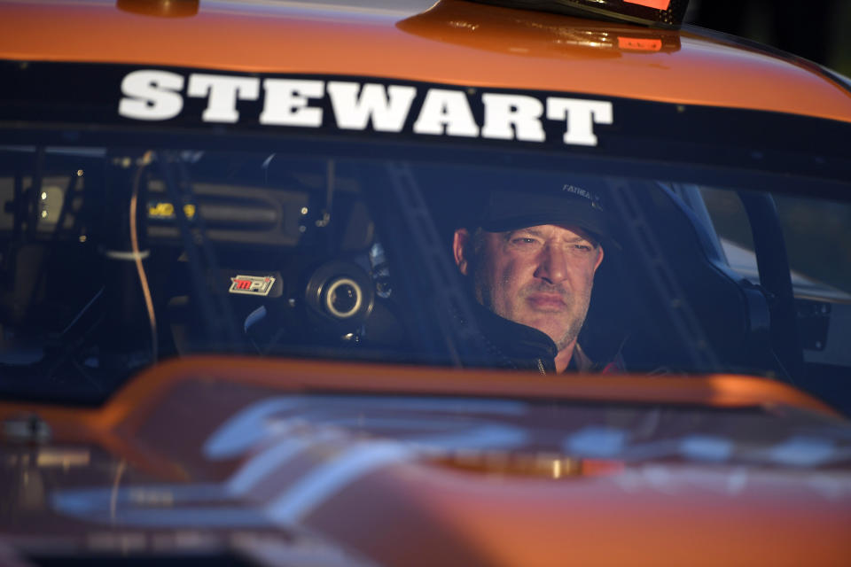 FILE- Tony Stewart sits in his car during the debut race of Superstar Racing Experience (SRX) at Stafford Motor Speedway, Saturday, June 12, 2021 in Stafford, Conn. The 51-year-old Stewart is embarking on his first season as a full-time NHRA driver. He will race a Top Alcohol dragster for McPhillips Racing when the season begins next week with the Gatornationals at Gainesville Raceway.(AP Photo/Jessica Hill, File)