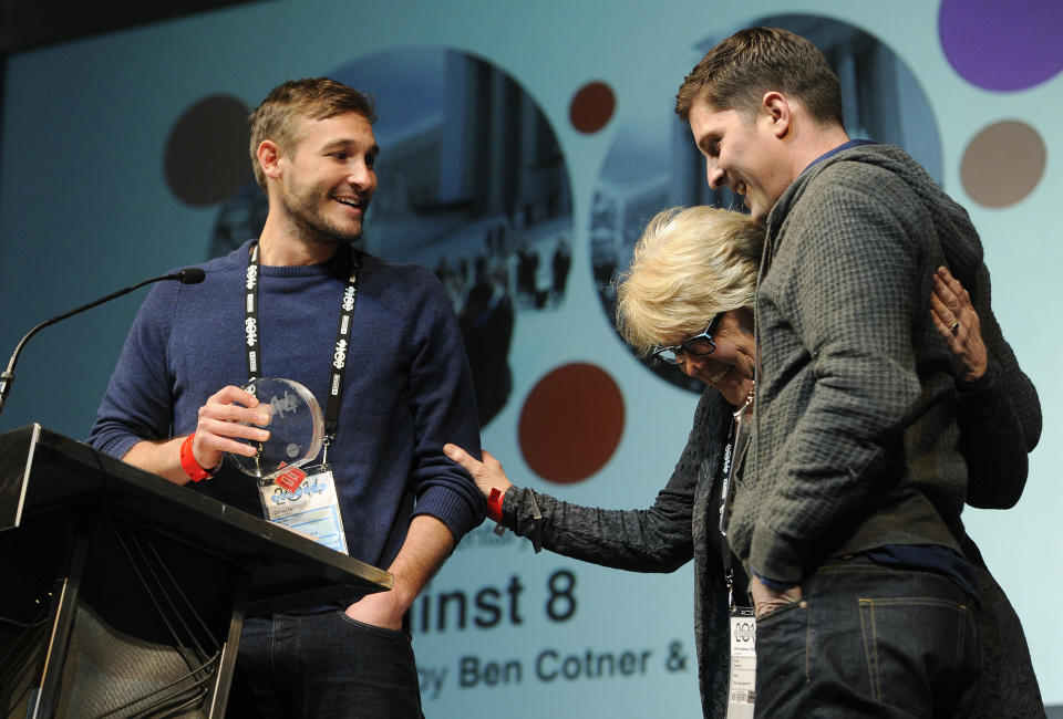 Ryan White, left, and Ben Cotner, co-directors of "The Case Against 8," are joined by their editor Kate Amend onstage after they won the Directing Award: Documentary for their film during the 2014 Sundance Film Festival Awards Ceremony on Saturday, Jan. 25, 2014, in Park City, Utah. (Photo by Chris Pizzello/Invision/AP)