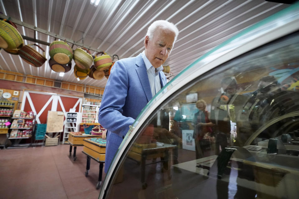 President Joe Biden look at pies in a case at the King Orchards fruit farm Saturday, July 3, 2021, in Central Lake, Mich. (AP Photo/Alex Brandon)
