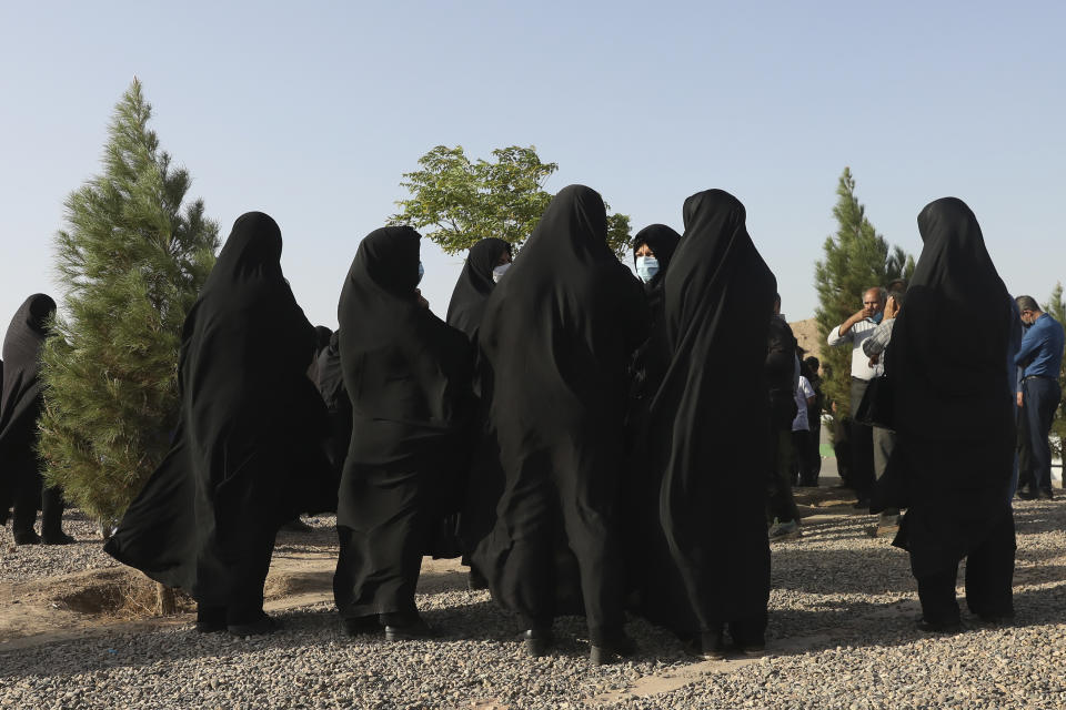 Relatives and family friends attend a funeral procession for their loved one, a Covid-19 victim, at Behesht-e-Masoumeh cemetery just outside the city of Qom, some 80 miles (125 kilometers) south of the capital Tehran, Iran, Wednesday, Sept. 15, 2021. (AP Photo/Vahid Salemi)