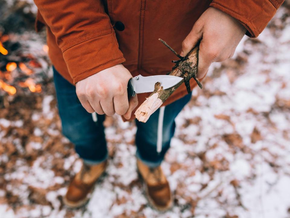 cutting wood with pocket knife