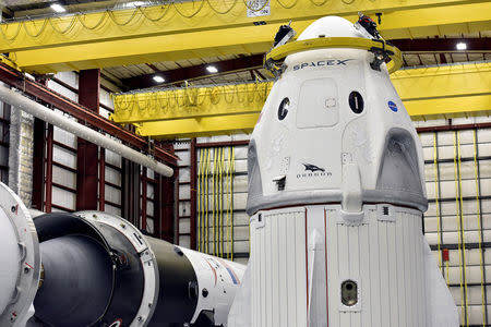 FILE PHOTO: The Dragon crew capsule sits in the SpaceX hangar at Launch Complex 39-A, where the space ship and Falcon 9 booster rocket are being prepared for a January 2019 launch at Cape Canaveral, Florida, U.S. December 18, 2018. REUTERS/Steve Nesius
