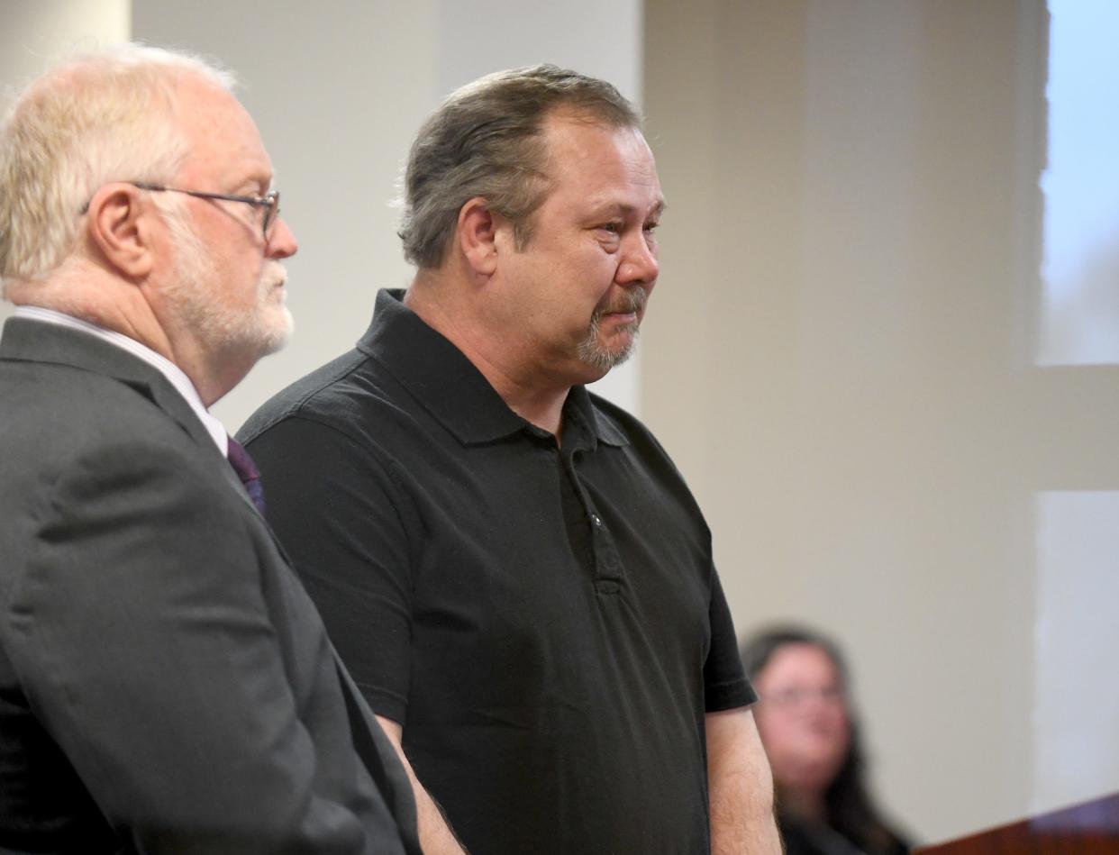 Douglas R. Mackey, right, stands with defense attorney Jeffrey Jakmides as Mackey is sentenced Wednesday in Carroll County Municipal Court for a crash that killed three people. Judge Gary L. Willen gave him a suspended jail sentence and imposed $630 in fines. The head-on crash occurred when he was driving his employer's truck near Dellroy.