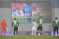 An image of Diego Armando Maradona is projected on a giant screen prior to the Serie A soccer match between Sassuolo and Inter Milan at the Mapei Stadium in Reggio emilia, Italy, Saturday, Nov. 28, 2020. (Massimo Paolone/LaPresse via AP)