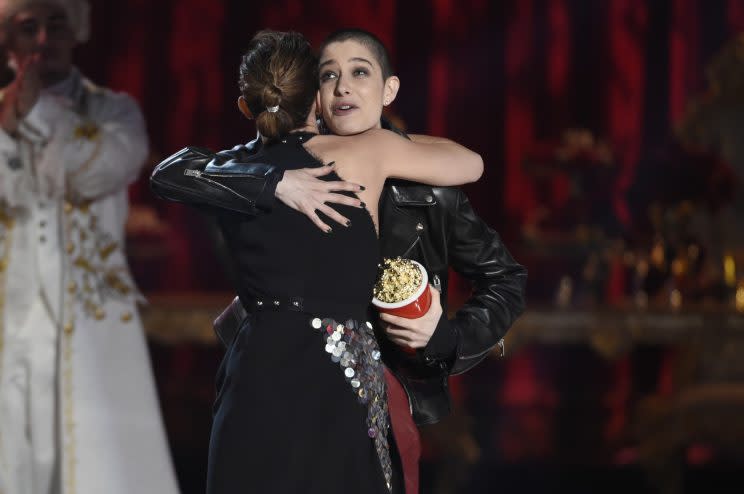 Emma Watson hugging Asia Kate Dillon while accepting the Best Actor in a Movie award. (Photo: AP Images) 