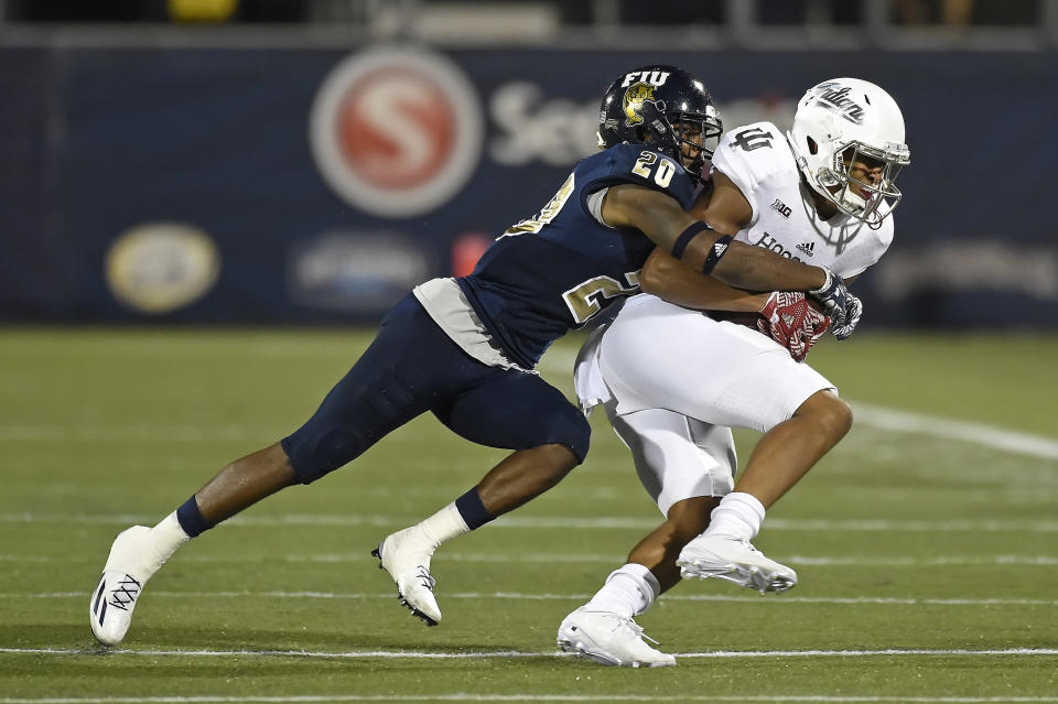 1 September 2016:  FIU defensive back Emmanuel Lubin (20) tackles Indiana wide receiver Nick Westbrook (15) in the first half as the University of Indiana Hoosiers defeated the FIU Golden Panthers, 34-13,  at FIU Stadium in Miami, Florida. (Photo by Samuel Lewis/Icon Sportswire via Getty Images)