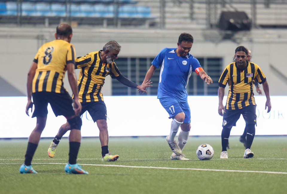 Singapore great Fandi Ahmad (blue jersey) during the match between Singapore and Malaysia football legends at the 