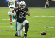 Las Vegas Raiders tight end Darren Waller (83) reacts after making a catch against the Miami Dolphins during the second half of an NFL football game, Sunday, Sept. 26, 2021, in Las Vegas. (AP Photo/Rick Scuteri)