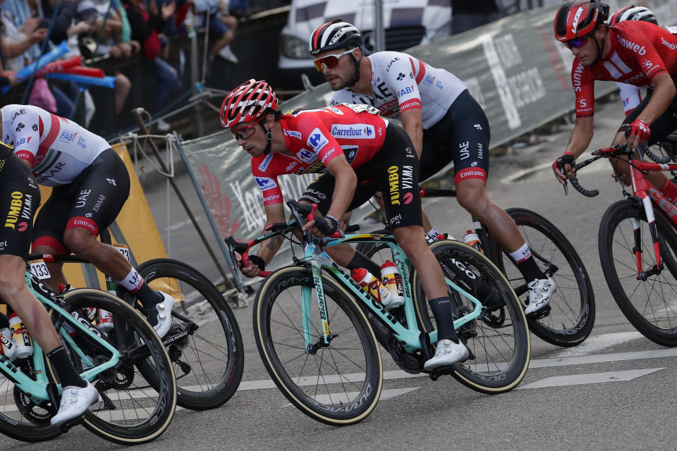 Race leader Primoz Roglic, centre, rides with the pack in the Spanish capital during the La Vuelta cycling race in Madrid, Spain, Sunday, Sept. 15, 2019. (AP Photo/Manu Fernandez)