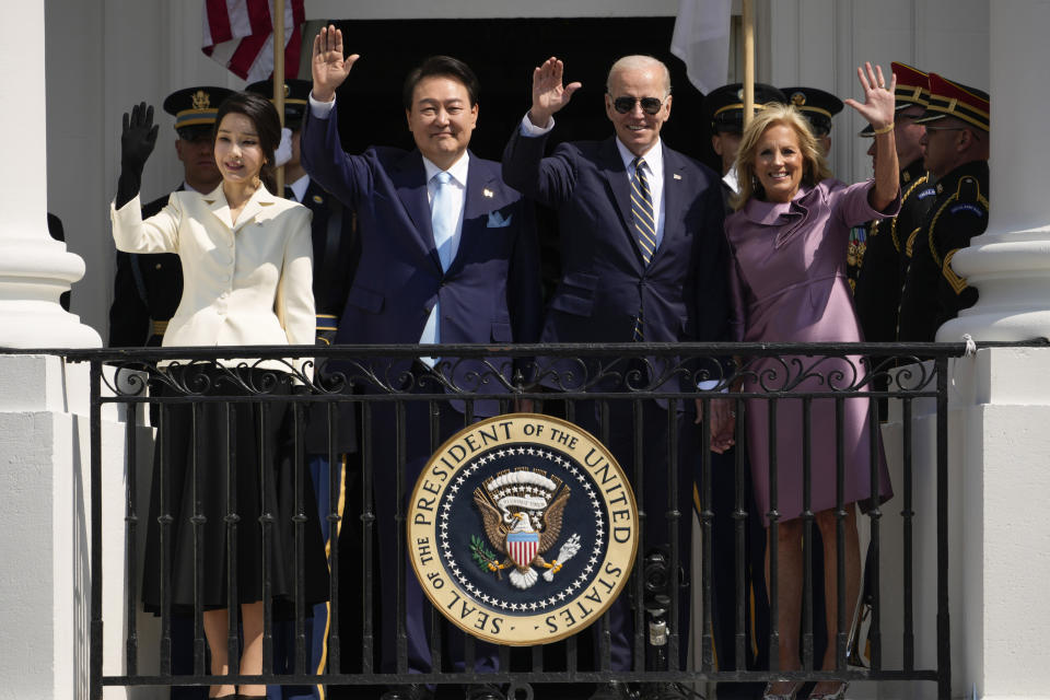 South Korea's first lady Kim Keon Hee, South Korea's President Yoon Suk Yeol, President Joe Biden and first lady Jill Biden wave from the Blue Room Balcony during a State Arrival Ceremony on the South Lawn of the White House Wednesday, April 26, 2023, in Washington. (AP Photo/Andrew Harnik)