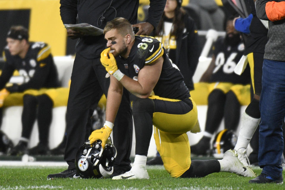 Pittsburgh Steelers tight end Pat Freiermuth (88) kneels on the sideline as Seattle Seahawks defensive end Darrell Taylor (52), unseen, is tended after being injured during the second half an NFL football game, Sunday, Oct. 17, 2021, in Pittsburgh. (AP Photo/Don Wright)