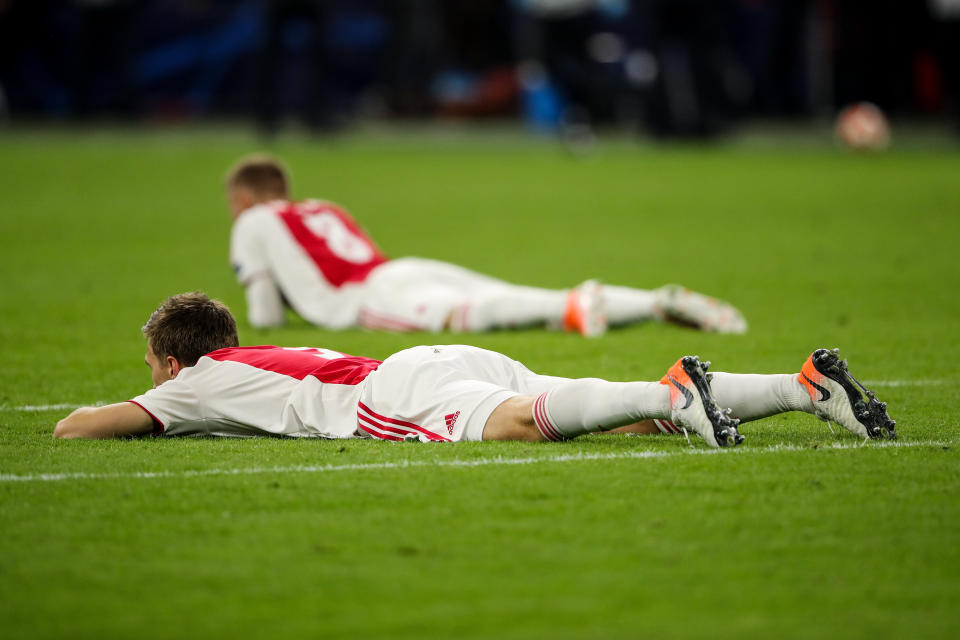 Devastated Ajax following the late drama in Amsterdam (Photo by Matthew Ashton - AMA/Getty Images)