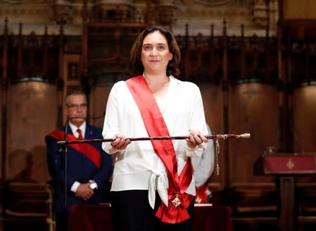 Ada Colau poses during her swearing-in ceremony as the new mayor of Barcelona, at Barcelona's town hall