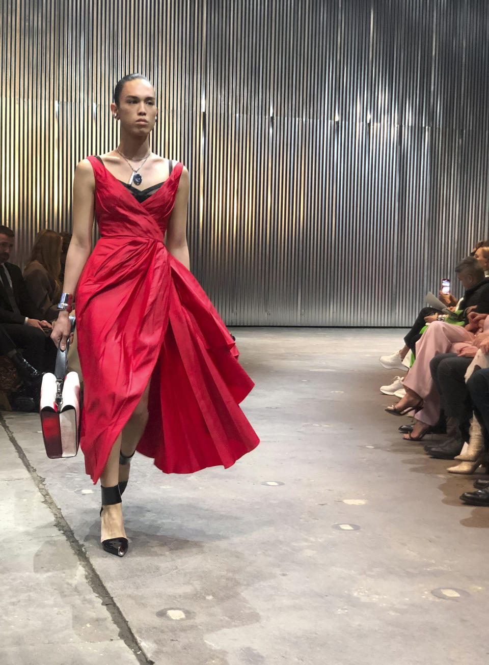 A model walks the runway wearing fashion from the Alexander McQueen Autumn/Winter 2022 collection on Tuesday, March 15, 2022 in New York. (AP Photo/Leanne Italie)