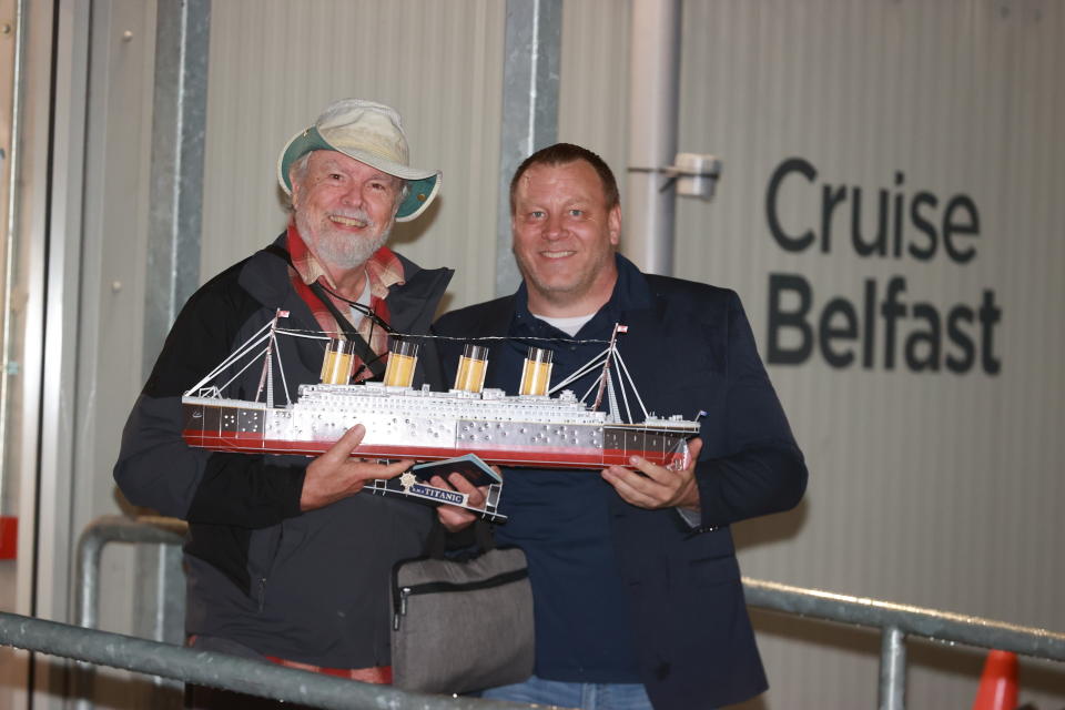 Villa Vie Residences CEO Mikael Petterson with passenger Andy Garrison (left) as he prepares to board the Villa Vie Odyssey cruise ship. (LI)