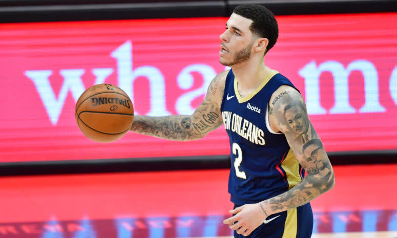 Pelicans PG Lonzo Ball dribbles the ball up the court.